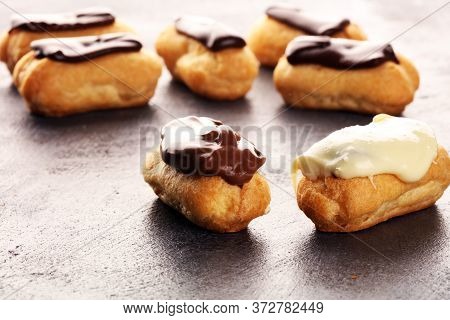 Traditional French Dessert. Eclair With Chocolate Icing. Pastery Dessert Concept