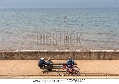 Hunstanton, Norforlk/ United Kingdom- 14 June 2020: Old People Observing Social Distancing On The Se