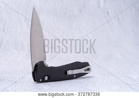 Folding Knife With Auto Ejection System. Mirror-polished Knife Blade.