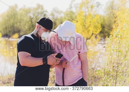 Man Smoking Shesha, Hookah Near The Lake Alone.