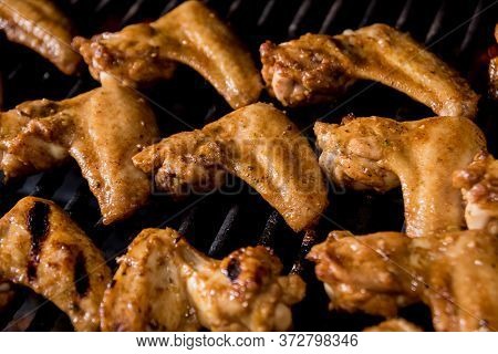 Fried Chiken Wings At Grill Barbecue. Restaurant.
