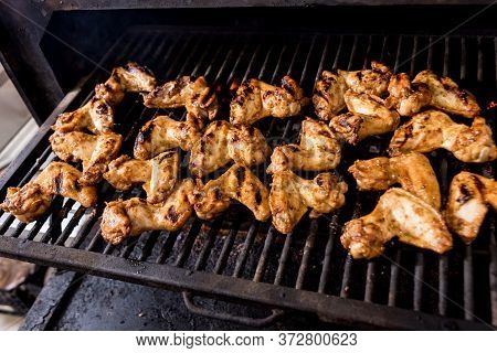 Fried Chiken Wings At Grill Barbecue. Restaurant.