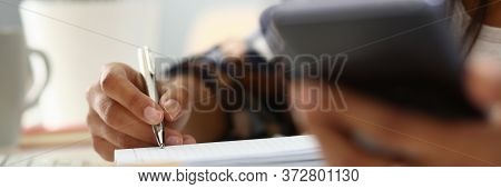 African Woman Hold Modern Smartfone In Hand And Make Note Closeup. Telework Apps Concept.