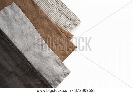 Set Of Four Brown And Gray Pure Linen Cotton Napkins Isolated On White Background. Kitchen Textile C