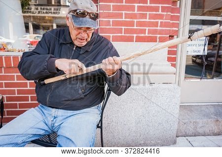 Harve De Grace Usa - October 25 2014; Street Carver Donny M In Downtown Street Whittling A Pattern O