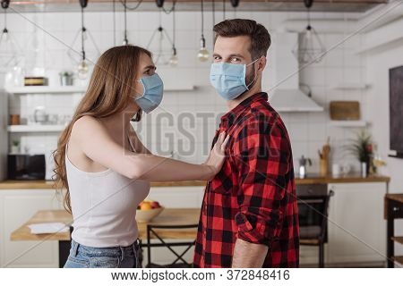 Girl Pushing Chest Of Boyfriend While Quarreling With Him In Kitchen