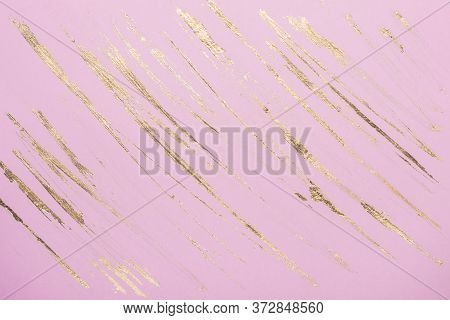 Abstract Gold Potal Brush Strokes On Pink Pastel Paper Background Or Texture