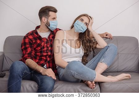 Man Looking At Depressed Girl Looking Away And Touching Head