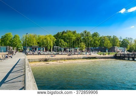 Olsztyn, Poland - May 31, 2020: City Beach On Ukiel Lake. View From Wooden Pier.