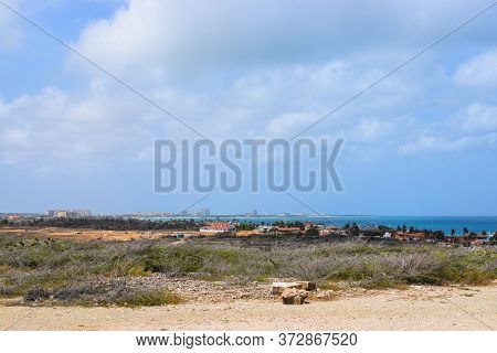 Arikok Natural Park On The Island Of Aruba In The Caribbean Sea With Deserts And Ocean Waves On The