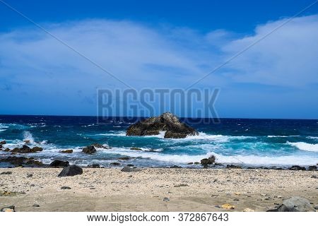 Arikok Natural Park On The Island Of Aruba In The Caribbean Sea With Deserts And Ocean Waves On The
