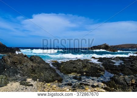 Arikok Natural Park On The Island Of Aruba In The Caribbean Sea With Deserts And Ocean Waves On The