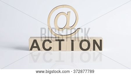 Wooden Blocks With The Text: Action With Wooden Sign E-mail