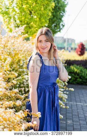 Sensual Calm Portrait Of Beautiful Hipster Woman In Blooming Bush With White Flowers Of Spirea. Copy