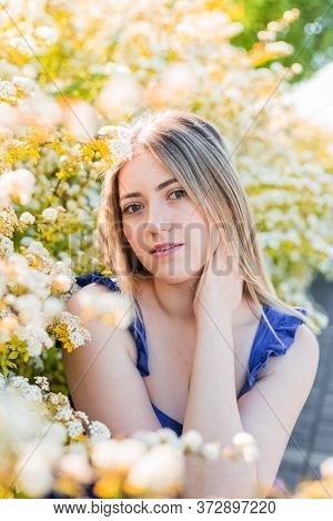 Sensual Calm Portrait Of Beautiful Hipster Woman In Blooming Bush With White Flowers Of Spirea. Copy