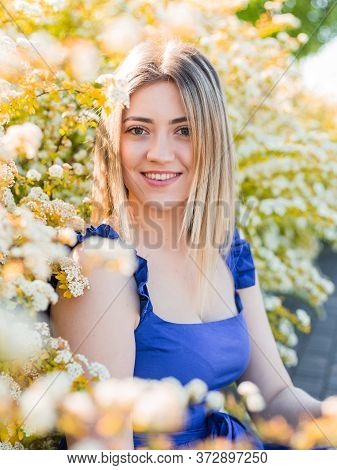 Sensual Calm Portrait Of Beautiful Hipster Woman In Blooming Bush With White Flowers Of Spirea. Copy