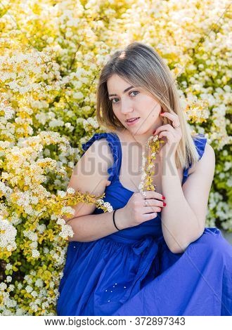 Sensual Calm Portrait Of Beautiful Hipster Woman In Blooming Bush With White Flowers Of Spirea. Copy