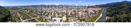 Spectaculat Cityscape Panorama Of A City With River Flowing By.