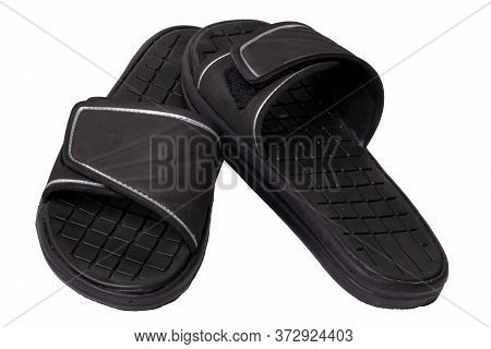 Close-up Of A Pair Of Black Rubber Sandals Or Slippers For The Shower Swimming Pool Or Beach With Sl