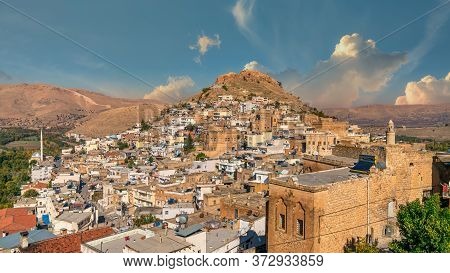Savur, Mardin, Turkey - January 2020: Town Of Savur With Old Stone Houses On A Hill With Dramatic Sk
