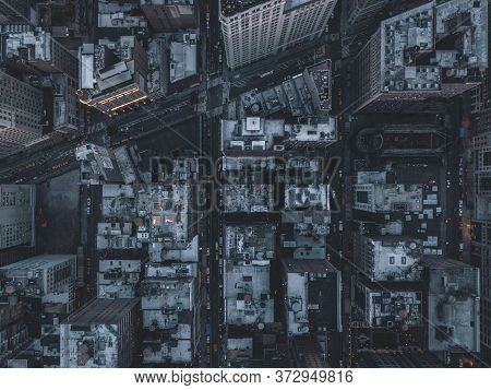 Aerial Overhead View Of Manhattan, New York City Streets Right After Dusk With Street Lights