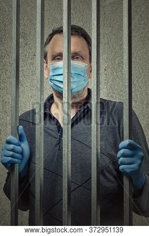 Mature Man Wearing A Face Mask And Blue Gloves Is Arrested For Quarantine Violation. He Is Placed In