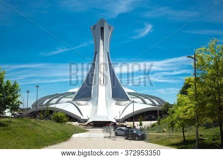 MONTREAL, CANADA- AOUT 10, 2018:  Olympic Stadium for 1976 Games and Biodome, one of four facilities that make part of the largest natural science museum complex  in Montreal, Canada.