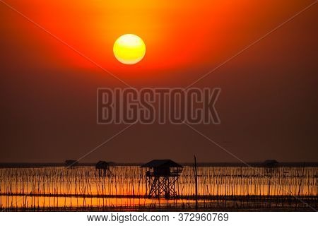 Beautiful Landscape View Of Sunset Time Going Down To In The Sea With Foreground Of Beach In Tropica