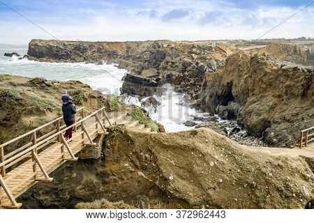 Father And Little Son Admiring Nature In Peniche, Portugal