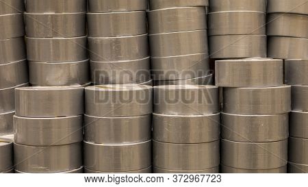 Coils Of Colored Insulating Tape Or Scotch Tape In A Row. Indastrial Grey Tape. Construction Electri