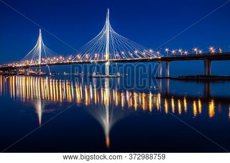 Cable-stayed Bridge Zsd At Night. Modern High Bridge Over The River. Night Landscape Of The City Of 