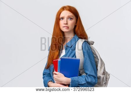 Worried Cute And Nervous Redhead Teenage Girl Scared Parents Scold Her For Skipping Class, Biting Li