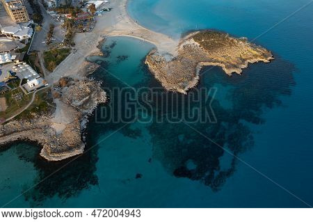 Aerial Drone View Of The Coastline Of Empty Beach In Winter. Summer Holidays. Nissi Beach Bay Ayia N