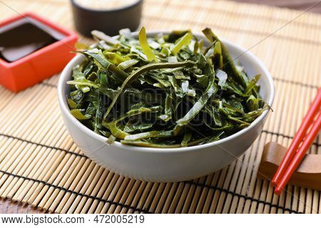 Fresh Laminaria (kelp) Seaweed Served On Wooden Table