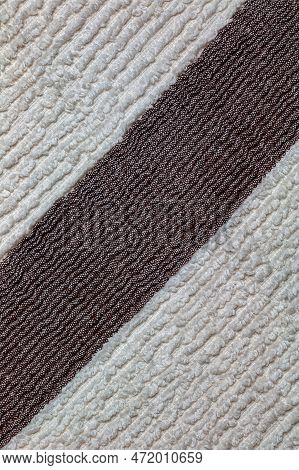 The Texture Of A Light Beige With A Brown Stripe Bath Towel With A Large Volume