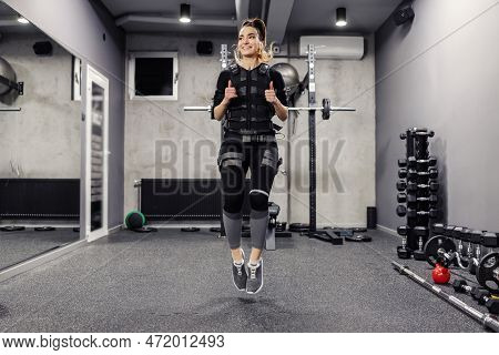 Electrical Muscle Stimulation, The Concept Of Ems Training. Shot From The Front Of A Woman Wearing A
