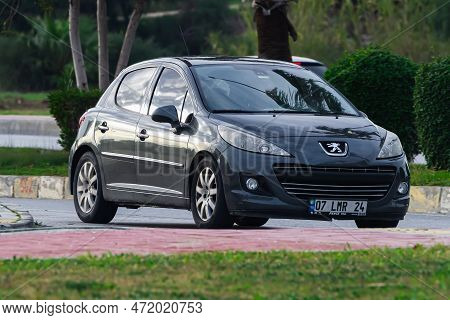 Side, Turkey -january 27, 2023:      Gtay Peugeot 308   Is  Driving   On The Street On A Warm Summer