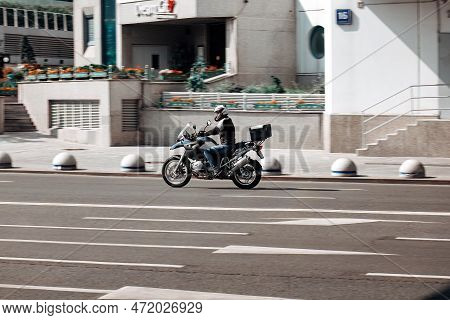 Moscow, Russia - August 2022: Motorcyclist On The Bmw R1200 Gs Motorcycle Driving On The City Street