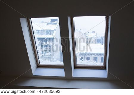 View Through The Attic Window In The City Center Of St. Petersburg In Winter