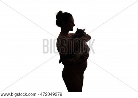 Silhouette Of A Woman During Pregnancy With A Cat In Her Hands, Isolated On A White Background. Conc
