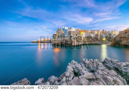 Fantastic Night Scene At Cala Paura Gulf With Bastione Di Santo Stefano In Village On The Rocks Poli