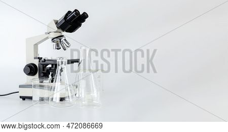 Black Metal Optical Microscope With Petri Dish Side View Isolated On Background. Slit Lamp And Biomi