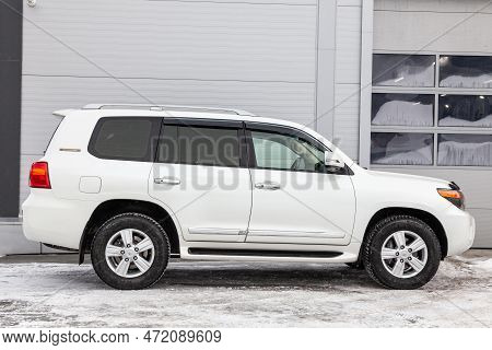 Novosibirsk, Russia - 04.03.2023: Side View Of Toyota Land Cruiser 200 J200 2013 Year White Color Af
