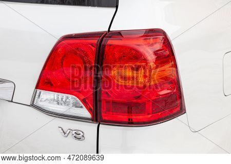 Novosibirsk, Russia - 04.03.2023: View On Taillight Of Toyota Land Cruiser 200 J200 2013 Year White 