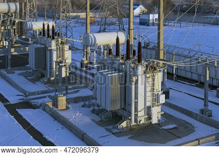 Top View Of The Electrical Substation In The Rays Of The Rising Winter Sun. Electrical Substation Wi