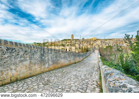 Breathtaking View On Gravina In Puglia Ancient Town, Bridge And Canyon At Sunrise. Panoramic View Of