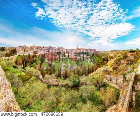 Breathtaking View On Gravina In Puglia Ancient Town, Bridge And Canyon At Sunrise. Panoramic View Of