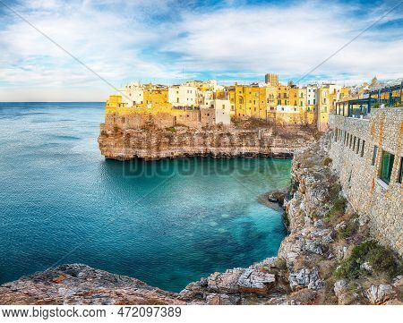 Amazing View On Polignano A Mare Village On The Rocks At Sunset. Polignano A Mare, Apulia, Italy, Pr