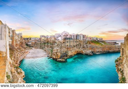 Stunning Sunset At Cala Paura Gulf With Bastione Di Santo Stefano And Lama Monachile Beach In Backgr