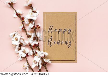 Sprigs Of The Apricot Tree With Flowers On Pink Background Text Happy Nowruz Holiday Concept Of Spri